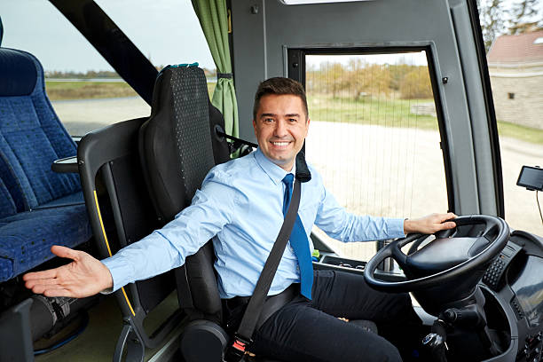 happy driver inviting on board of intercity bus transport, tourism, road trip, gesture and people concept - happy driver inviting on board of intercity bus coach bus photos stock pictures, royalty-free photos & images