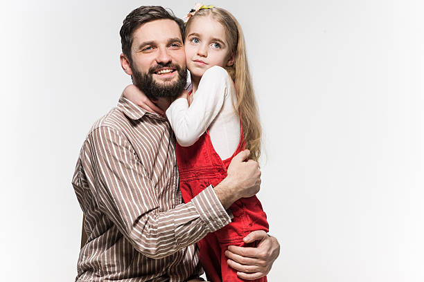 istock Girl hugging her father  over a white background 524177666