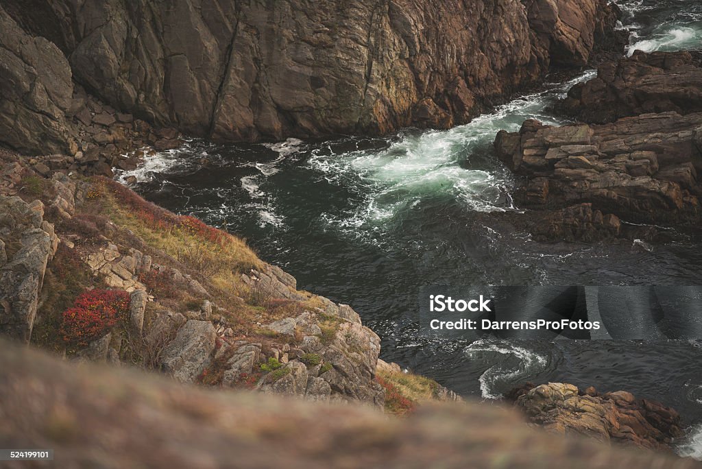 Rocky shores of Newfoundland Water pounds ancient Newfoundland shores. Autumn Stock Photo