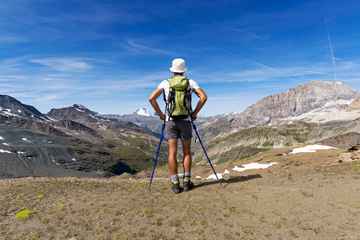Man trekking in the Alps. Grand Paradiso National Park. Italy