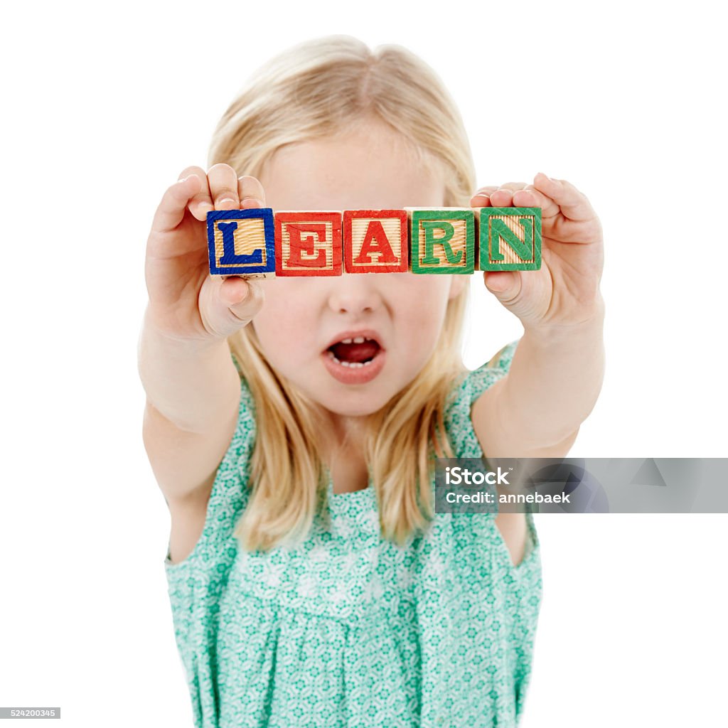 Never block a child's path to education Studio shot of a cute little girl holding building blocks that spell the world 'learn' against a white background Child Stock Photo