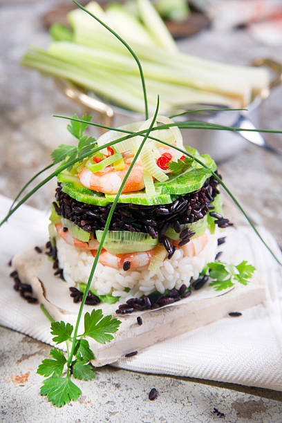 istock Tower of black and white rice with shrimp and zucchini 524200785