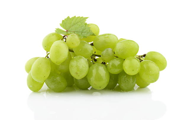 istock Bunch of white grapes isolated on white with leaf 524203037