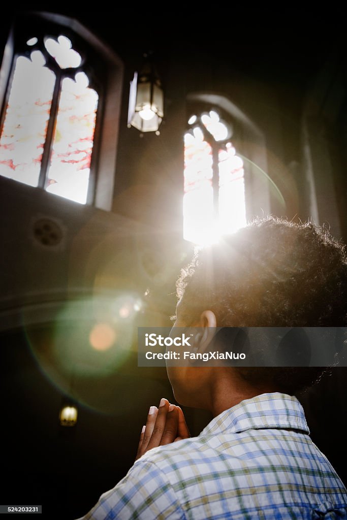 Boy Praying in Church Looking Out Window Church Stock Photo