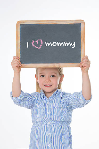 istock portrait of kid holding blackboard 524227275