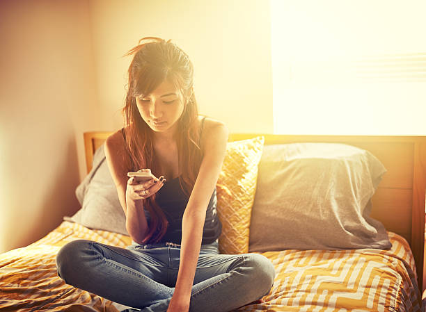 istock tech savvy asian teen girl using smart phone 524227853