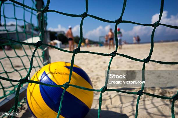 Yellow Ball In The Goal On The Beach Stock Photo - Download Image Now - Backgrounds, Beach, Blue