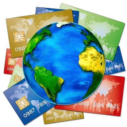 various bank credit cards on a globe