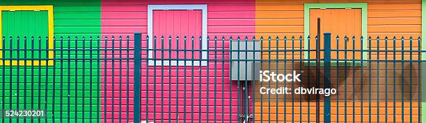 Blue Fence By Colorful Walls Stock Photo - Download Image Now - Architecture, Bahamas, Blue