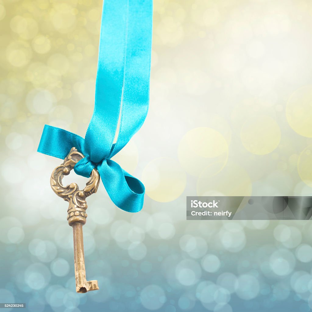 key on ribbon vintage sceleton key on ribbon on bokeh  background Defocused Stock Photo