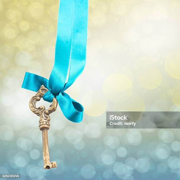 Key On Ribbon Stock Photo - Download Image Now - Defocused, Gold Colored, No People