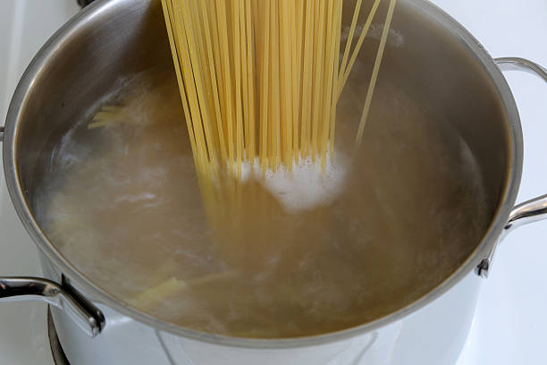 istock Preparing spaghetti pasta meal cooking noodles in water 524233807