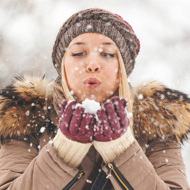 istock Young blonde girl playing with show 524258769