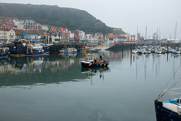 istock Small fishing boat entering Scarborough harbour. 524261317