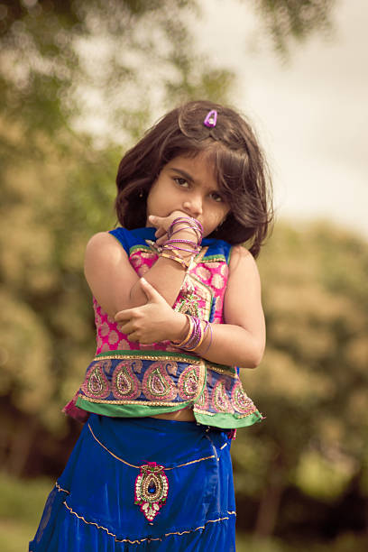 Little Girl Wearing indian Princess Dress posing in nature