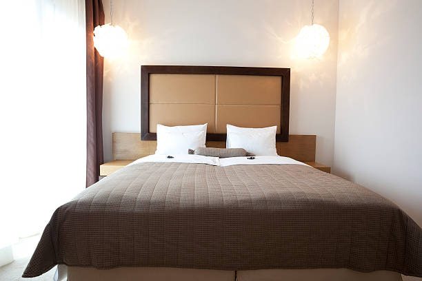 istock Elegant double bed in hotel room 524263093