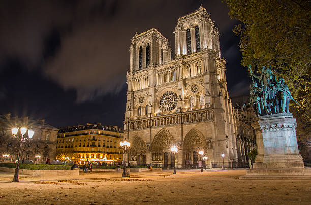 istock Night view on illuminated Notre Dame cathedral in Paris 524264949