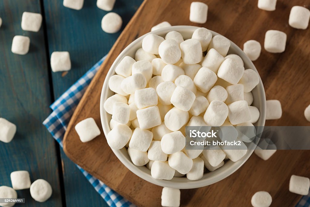 White Mini Marshmallows in a Bowl Unhealthy White Mini Marshmallows in a Bowl Candy Stock Photo