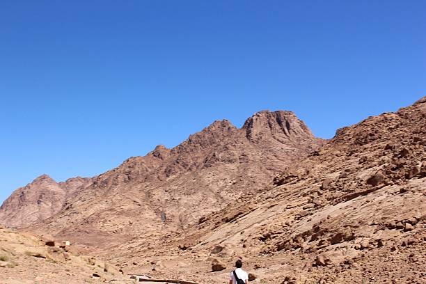 istock Group of hikers and mountaineers under the blue sky 524265461
