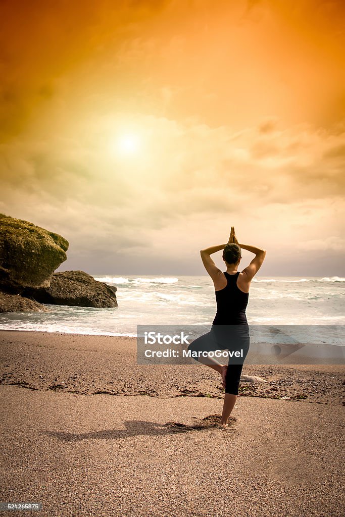 Yoga woman Woman doing yoga on a beach Adult Stock Photo