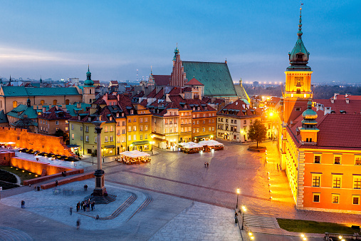 illuminated Royal Castle ,Castle Square with Sigismund's Column at Dusk, Warsaw, Poland; elevated view