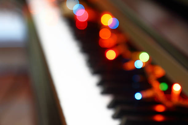 istock Abstract Christmas musical background with piano and lights. 524285521