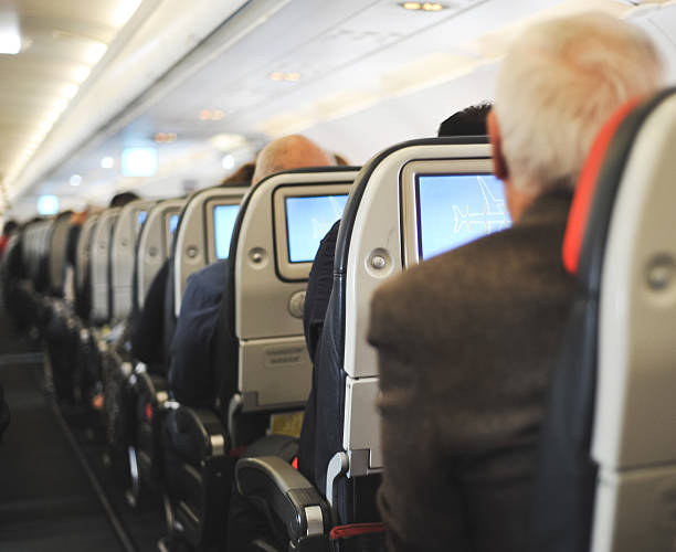 istock People sitting in an airplane 524285599