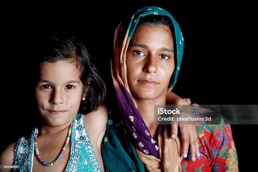 Indian Women Standing with Her Daughter Confident Young Indian Women Standing Portrait with her Daughter using Studio Lights. 30-39 Years Stock Photo