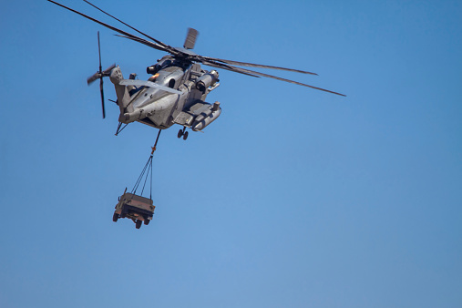 CH-53E Super Stallion (Sikorsky) Helicopter carrying military humvee