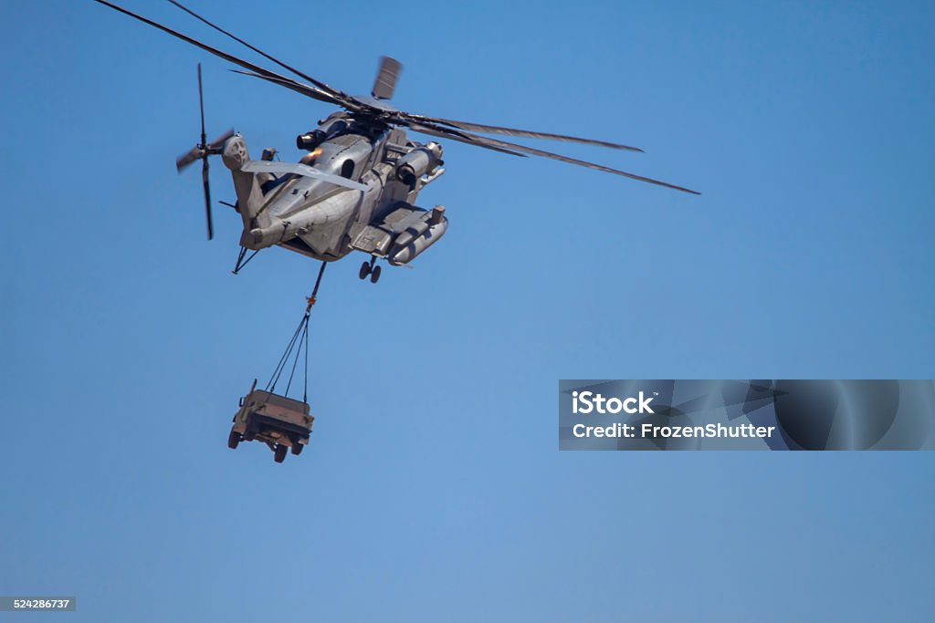 CH-53E Super Stallion (Sikorsky) Helicopter carrying military humvee Military Helicopter Stock Photo
