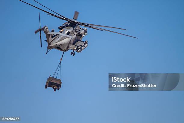 Ch53e Super Stallion Helicopter Carrying Military Humvee Stock Photo - Download Image Now