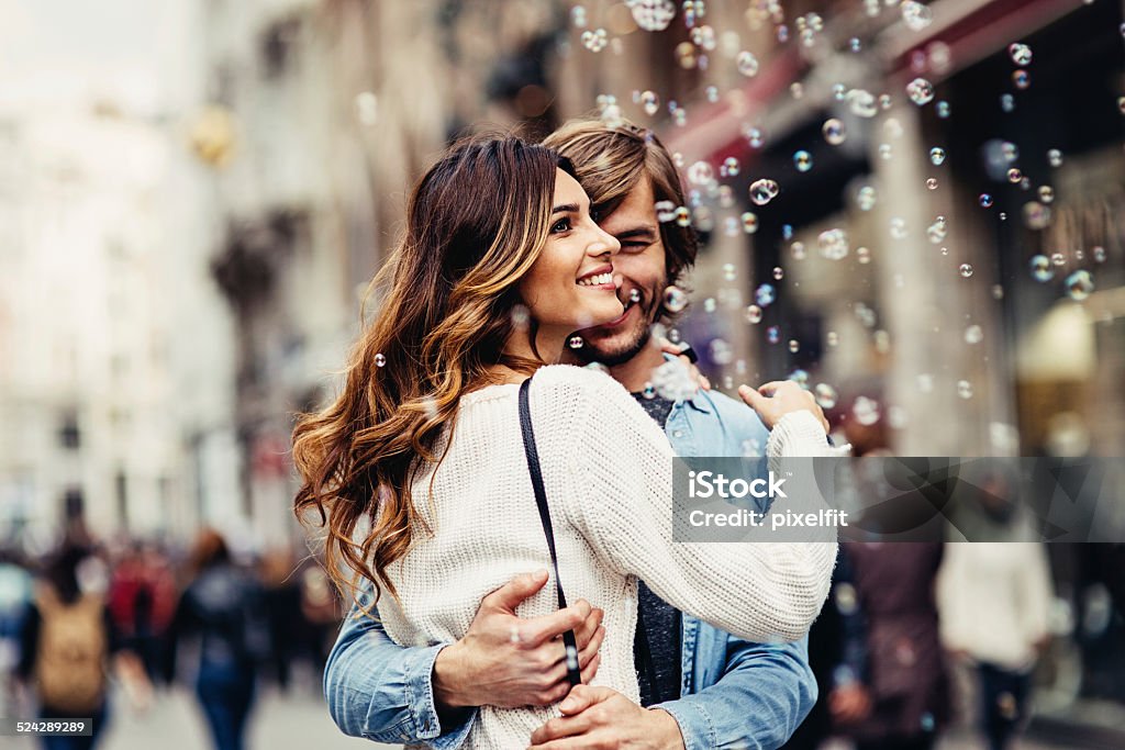 Young couple having great time on the street Shot made during Istockalypse Istanbul 2014 event. Couple - Relationship Stock Photo