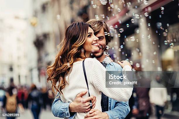 Young Couple Having Great Time On The Street Stock Photo - Download Image Now - Couple - Relationship, Flirting, Togetherness