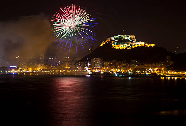 Alicante City by Night with Blue and Red Fireworks Alicante City by Night with Blue and Red Fireworks Bonfire stock pictures, royalty-free photos & images