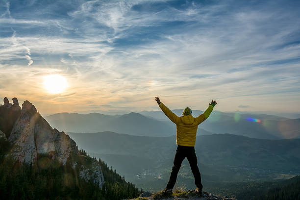 istock celebrating success in the sunset 524290441