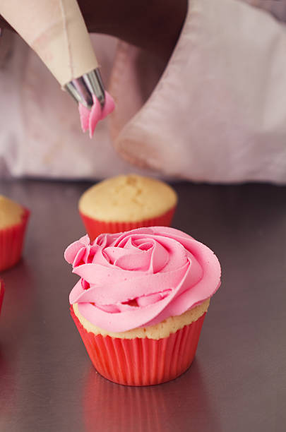 istock Cupcake with pink rose piping 524297353