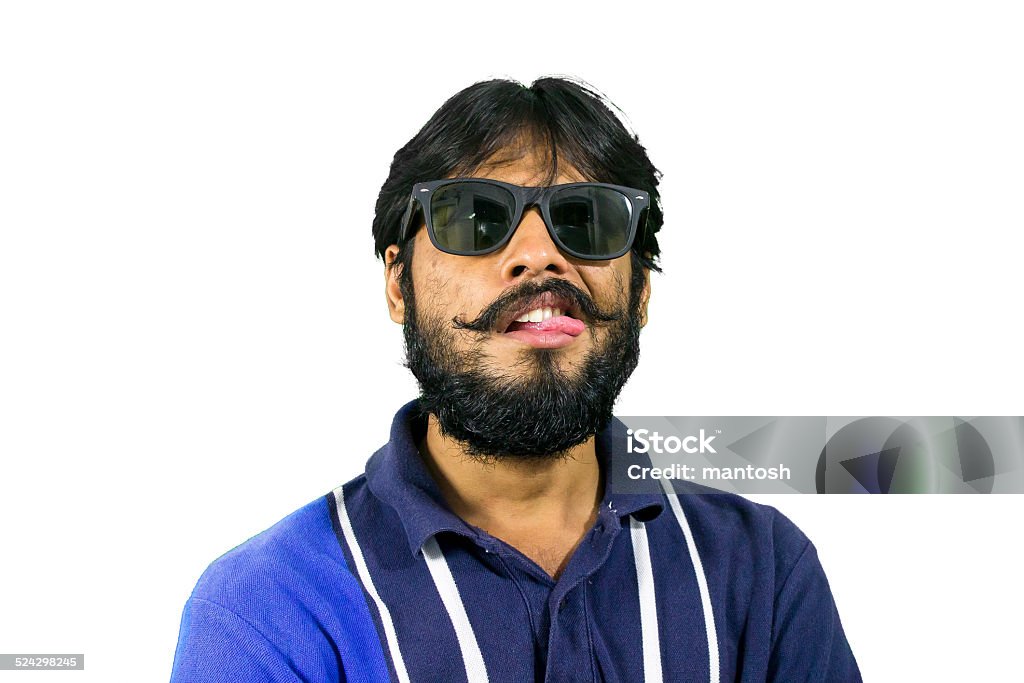 Young man stuucking su tounge out - Foto de stock de Expresión facial libre de derechos