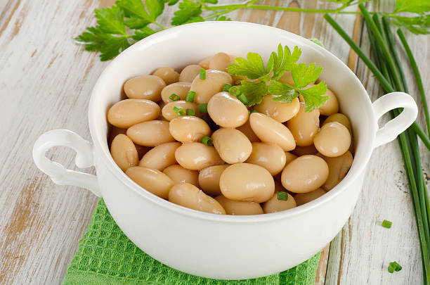 istock Beans with fresh herbs   on  wooden table. 524299025