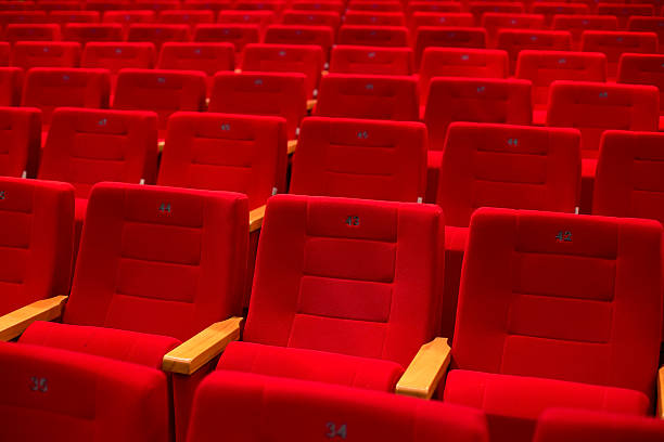 istock Red and empty theater seats in a row 524299119