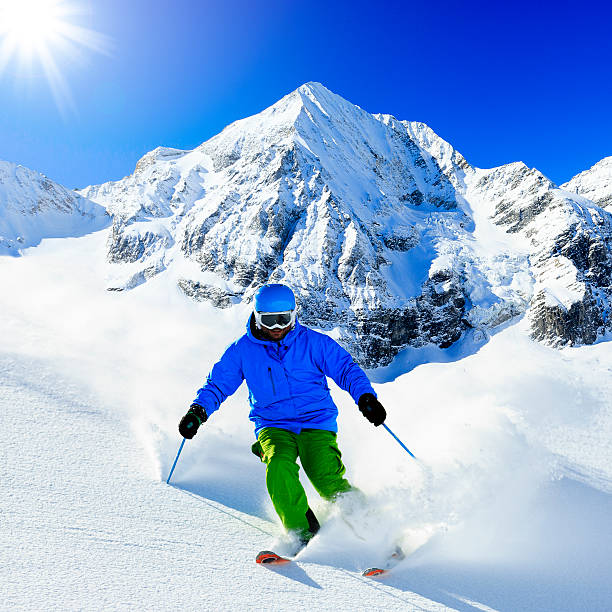 istock Freeride in fresh powder snow - man skiing downhi 524300957