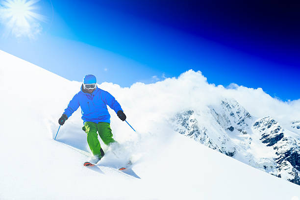 istock Freeride in fresh powder snow - man skiing downhill 524301599