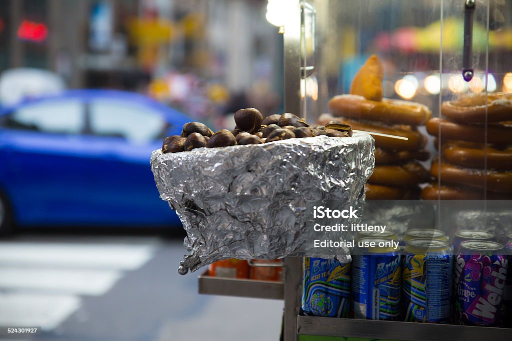 NYC Chestnuts New York City, New York, USA - November 16, 2014:  Hot chestnuts on food cart along Fifth Avenue in Midtown Manhattan at holiday time.   Roasted chestnuts are a seasonal treat sold during the holiday season in New York City. Avenue Stock Photo