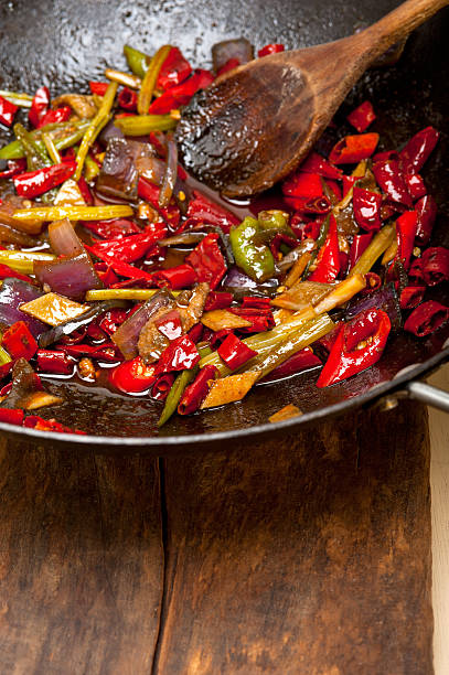 istock fried chili pepper and vegetable on a wok pan 524302031