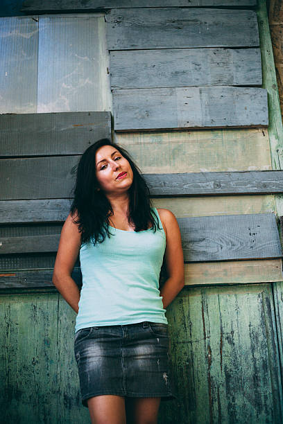 istock Girl against a barn door 524303869