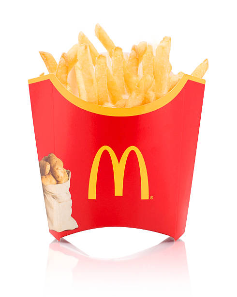 McDonald's fries Belgrade, Serbia - November 5, 2014: McDonalds fries on white background. McDonald's is one of the World's largest fast food franchise. MCDONALDS FRIES stock pictures, royalty-free photos & images