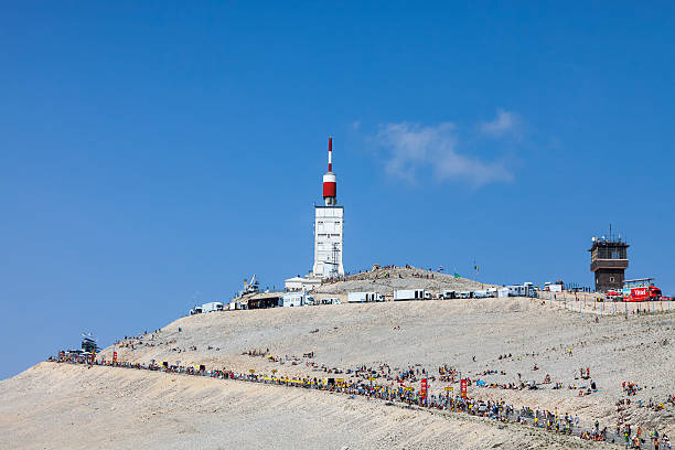 Mount Ventoux Mont Ventoux, France- July 14 2013: Arid landscape on Mount Ventoux with spectators and technical trucks doing various activities many hours before the apparition of the competitors during the stage 15 of the 100 edition of Le Tour de France 2013. tour de france stock pictures, royalty-free photos & images
