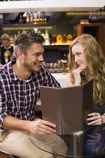 istock Young couple discussing the menu 524323217