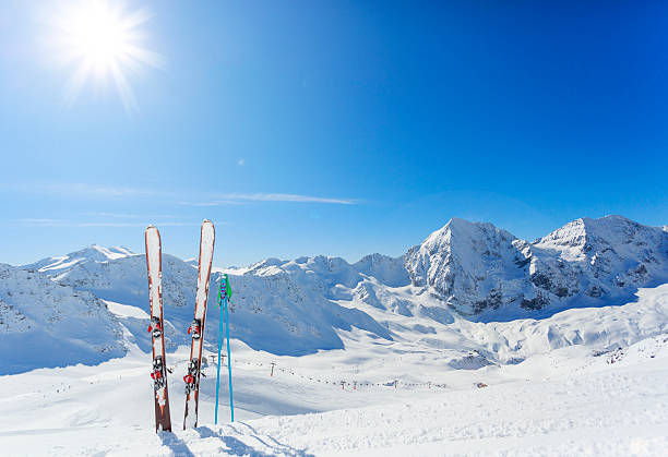 Mountains and ski equipments on slope Skiing equipments on ski slope in italian Alps apres ski stock pictures, royalty-free photos & images