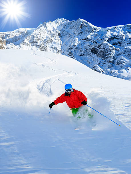 istock Freeride in fresh powder snow - man skiing downhi 524324311