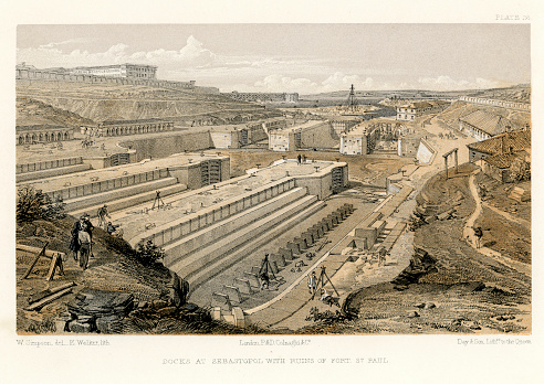 Vintage engraving showing a scene from the Crimean War 1853 to 1856, a conflict in which Russia lost to an alliance of France, Britain, the Ottoman Empire, and Sardinia. Drydocks at Sebastopol with ruins of Fort St Paul.
